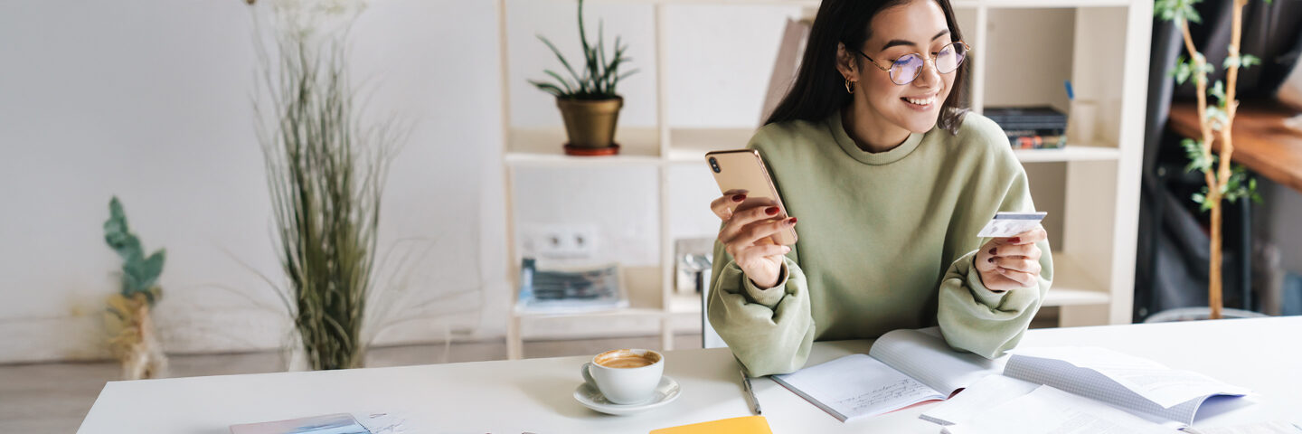 Woman checking her credit score on laptop
